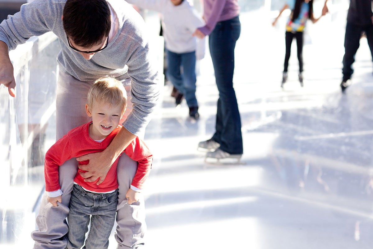 Father & Young Son Skate Together Father & Young Son Skate Together