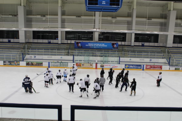 Wide Shot of Two Hockey Teams On Ice Wide Shot of Two Hockey Teams On Ice